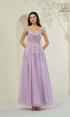 A woman poses in a lilac Lucci Lu 1443 long prom dress featuring embroidered tulle, sheer bodice details, and 3D floral appliques against a neutral background.