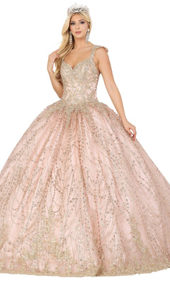 A woman poses gracefully against a white background in Dancing Queen’s Quinceanera Dress 1478—a sparkling light pink ball gown with gold embellishments, cap sleeves, jeweled tiara, and large earrings.