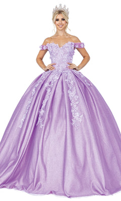 A woman wearing the Quinceanera Dress 1501 by Dancing Queen—a lavender, off-the-shoulder A-line ball gown with a sweetheart neckline and floral appliques—stands against a white background, accessorized with a tiara.