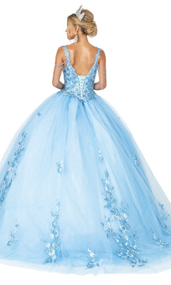 A woman in the Quinceanera Dress 1546 by Dancing Queen, featuring floral accents, beaded draped shoulder, tiara, lace-up back, and a voluminous tulle skirt, stands facing away.