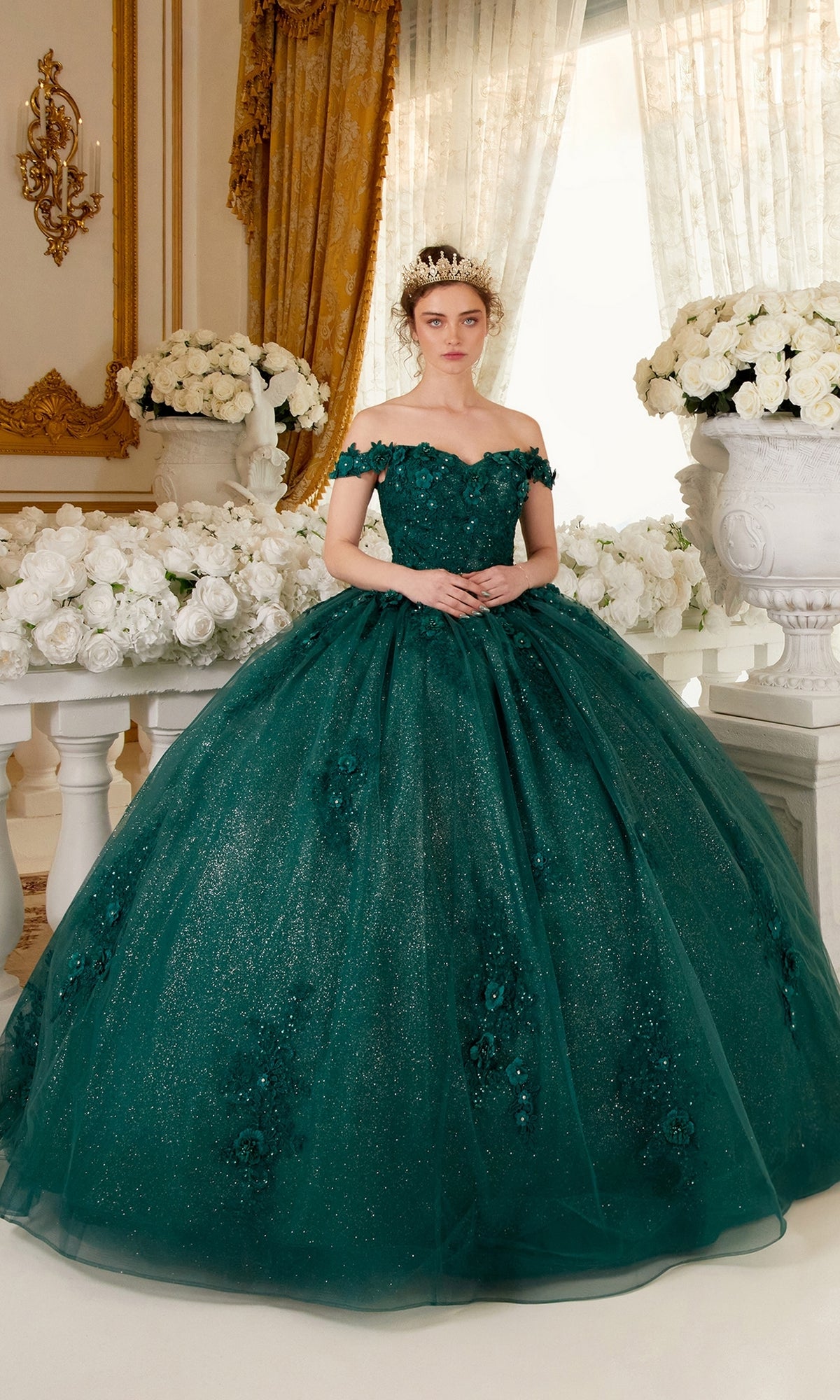 A woman wearing the Ladivine 15702 Quinceañera Dress with 3-D Flowers and a tiara stands in an ornate room adorned with white floral arrangements and classical decor.
