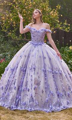 Outdoors, a woman wears the Off-the-Shoulder Quince Ball Gown: Ladivine 15704 in lavender, featuring floral accents and sparkling sequins.