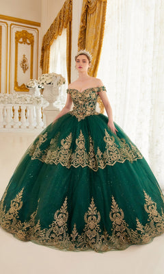 A woman in the Ladivine 15705 Quince Dress with gold embroidery and a tiara stands in an ornate room featuring gold curtains and white floral arrangements.
