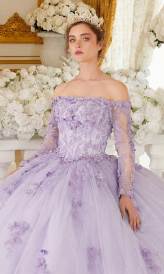 A woman in the Ladivine 15706 Lilac Purple Quinceañera Dress with delicate beaded embroidery and a tiara sits before a white floral arrangement.