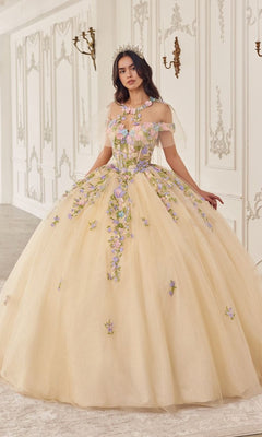 In an ornate room, a woman wears the Quinceanera Dress 15724 by Ladivine—a stunning off-the-shoulder light yellow ball gown with purple and pink floral appliqués and a tiara.