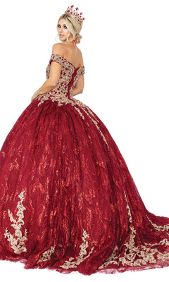 A woman poses against a white background wearing the Burgundy Quinceanera Dress 1579, featuring a sweetheart neckline, ornate full skirt, and matching crown.