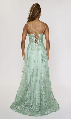 Model wears the Long Formal Dress Nina Canacci 1589, a light green, floor-length A-line gown with an embellished bodice, lace-up back straps, and floral patterns, shown from behind against a plain white background.