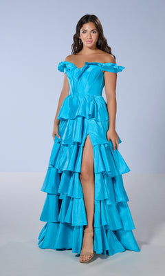 A woman models the Tiffany 16175 long prom dress, featuring a bright blue off-the-shoulder corset bodice, ruffled gown, and thigh-high slit, standing against a plain light background.