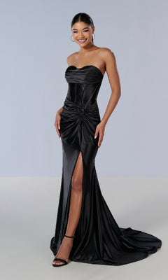 Model wears the Long Prom Dress: Tiffany 16180—strapless with a corset bodice, sweetheart neckline, ruched details, thigh-high slit, and floor-length hem—posing against a plain light background.