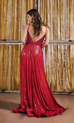 A woman stands with her back to the camera in front of gold curtains, wearing the Long Prom Dress: Tiffany 16189—a shiny red rhinestone embellished gown with a low back.