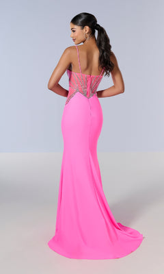 A woman stands facing away against a plain light background, wearing the Tiffany 16201 long prom dress in bright pink, featuring a slim fit and rhinestone-embellished sheer panels on the back.