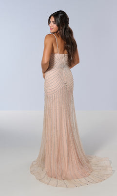 A woman stands against a light background in the Tiffany 16202 long prom dress, featuring a sleeveless, floor-length champagne design with silver beading, looking over her shoulder.