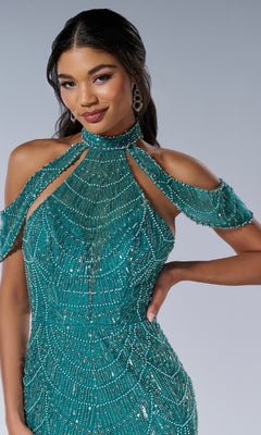 A woman poses with one hand on her hip in the Tiffany 16207— a fitted, floor-length teal prom dress featuring beaded details, a halter neckline, and cold-shoulder sleeves against a plain background.