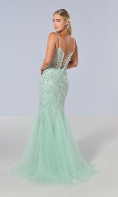 A woman models the Tiffany 16218 long prom dress in mint green, featuring a sheer corset bodice, sequin-beaded mermaid details, and a lace-up back, posed against a plain light background.