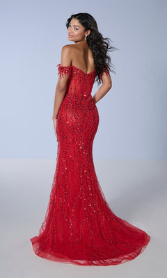 A woman in the Tiffany 16233 long, fitted off-the-shoulder sequin prom dress stands facing away, looking back over her shoulder against a plain background.