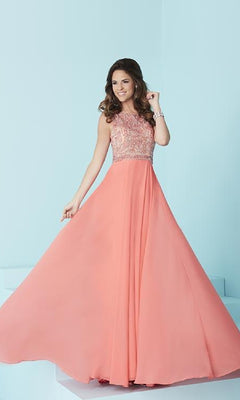 A woman wearing a Backless Long A-Line Formal Gown stands against a light blue background; the gown features a sleeveless design, embellished bodice, and flowing peach skirt.