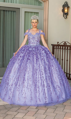 A person stands outdoors in front of glass doors, wearing the Quinceanera Dress 1640 By Dancing Queen, an off-shoulder lavender a-line ball gown with floral details and a silver crown.