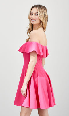 A woman in the Off-the-Shoulder Short Party Dress stands sideways and smiles at the camera against a plain, light background.