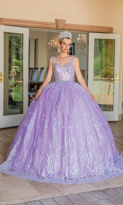 A woman stands indoors before open double doors, wearing the Dancing Queen Quinceanera Dress 1685—a light purple a-line ball gown with silver embroidery, sweetheart neckline, and a sparkling silver crown.