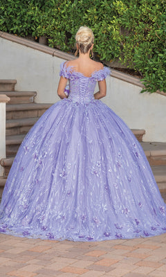 A person with blonde hair in an updo stands on outdoor steps wearing the Quinceanera Dress 1694 By Dancing Queen, a lilac off-the-shoulder ball gown with a full skirt and sparkling embellishments.