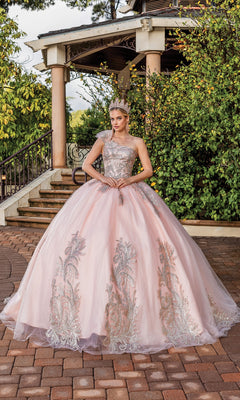 A woman in the Dancing Queen 1733 one-shoulder long quince dress stands on a brick path before a garden gazebo.