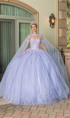 Young woman in Quinceanera Dress 1785 By Dancing Queen—a lilac ball gown with sweetheart neckline and tiara—stands outdoors on a stone patio before a large window and ornate doorway.