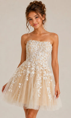 A woman wears the Short Homecoming Dress: Jovani 1830 in Off White/Nude, a strapless fit-and-flare design featuring a short beige tulle skirt embellished with white floral lace appliqués, as she stands against a plain light background.