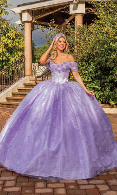 A woman poses gracefully outdoors in front of a gazebo, wearing the Quinceanera Dress 1864 By Dancing Queen in lilac purple with off-the-shoulder sleeves and floral details.