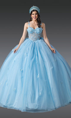 A woman stands against a gray background wearing the Quinceanera Dress 1879 by Dancing Queen in Bahama Blue, a ball gown adorned with floral and butterfly details, featuring a sweetheart neckline and a matching crown.