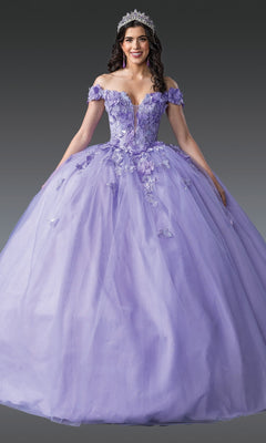 Woman wearing the Quinceanera Dress 1917 By Dancing Queen in lilac purple with 3D flower embellishments and off-the-shoulder sleeves, styled with a tiara and earrings, stands against a gray background.