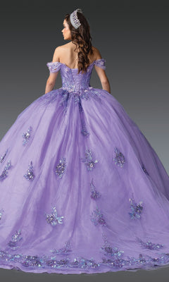 A woman in the Quinceanera Dress 1929 By Dancing Queen, featuring off-the-shoulder lilac design and floral embellishments, wears a tiara and is photographed from the back against a gray background.