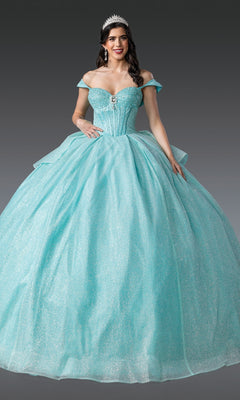 A woman in the Quinceanera Dress 1937 By Dancing Queen, a sparkling light blue ball gown with off-the-shoulder straps and a tiara, stands against a plain gray background.