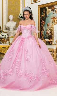 A woman in the Quinceanera Dress 1944 By Dancing Queen, featuring an ornate pink design and corset bodice, stands in an opulent room with gold decor, a white statue, and classical paintings.