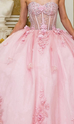 A person wearing the Quinceanera Dress 1949 By Dancing Queen: a strapless pink gown with a fitted, beaded corset bodice and a voluminous glitter tulle ball gown skirt decorated with floral appliqués.