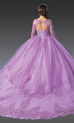 A woman is seen from the back wearing the Quinceanera Dress 1956 By Dancing Queen, a long-sleeved lilac gown with lace details and a full train, set against a gray background.