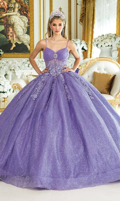 A young woman stands indoors wearing the Dancing Queen 1958 Long Quinceañera Dress with Bow and a tiara, surrounded by white and gold furniture and floral arrangements.