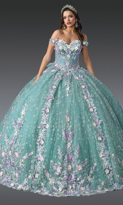 A woman in the Quinceanera Dress 1962 By Dancing Queen, a large pastel teal ball gown with floral embroidery, off-the-shoulder sleeves, and a matching tiara stands against a plain dark background.