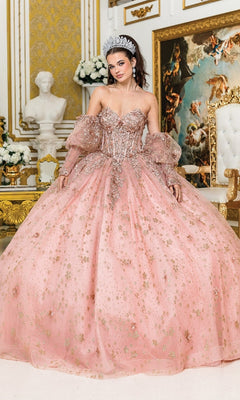 A woman wearing the Quinceanera Dress 1966 By Dancing Queen and a tiara poses in an ornate room with gold accents, a white statue, and classical artwork.
