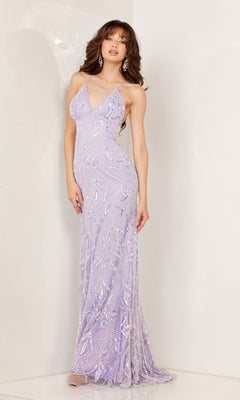 A woman in the Aleta Empire-Waist Long Sequin-Print Prom Dress, a sleeveless, floor-length gown with sequin embellishments and a v-neck, stands against a white wall.