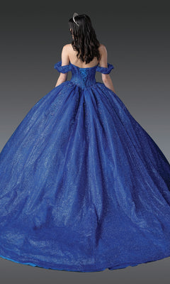 A woman, shown from the back against a plain gray background, wears the Royal Blue Quinceanera Dress 1992 By Dancing Queen—an off-the-shoulder, glittery ball gown—paired with a tiara.
