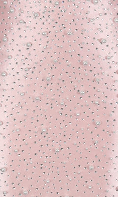 The Short Homecoming Dress: PromGirl Exclusive 250336 features light pink fabric with scattered rhinestone and pearl embellishments, ideal for a sleeveless mini dress look.