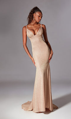 A woman poses elegantly against a plain gray background wearing the Draped Long Glitter Prom Dress: Aerie Couture 200—a fitted, floor-length champagne gown with thin straps.