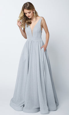 Woman in the Juliet 201 long prom dress—sleeveless, floor-length, silver glitter with an A-line skirt, deep V-neckline, and pockets—stands against a plain light background.