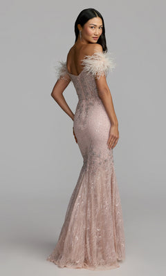 A woman wearing the Mac Duggal 20246 Off-Shoulder Long Formal Dress in blush, featuring lace accents and feathered off-the-shoulder sleeves, looks over her shoulder.