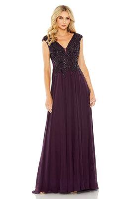 A woman wears the Mac Duggal 20264 Beaded-Bodice Long Formal Dress, a sleeveless, floor-length evening gown with an elegant beaded v-neck bodice in a rich dark purple shade.