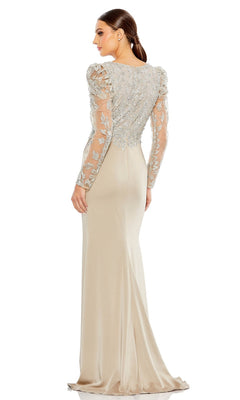 Woman wearing the Long Formal Dress 20346 by Mac Duggal, featuring a fitted taupe silhouette with sheer embroidered long sleeves and intricate floral embroidery on the bodice, standing with her back to the camera.