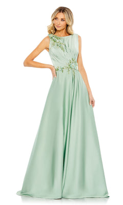 A woman poses against a white background in the Mac Duggal 20365 sleeveless long formal dress, a light green evening gown featuring floral embroidery on the bodice.