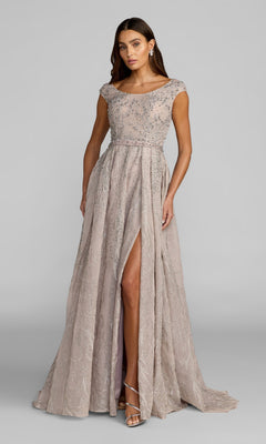 A woman wearing the Mac Duggal 20374 long formal dress in taupe, featuring beaded embellishments, cap sleeves, a fitted bodice, and a high front slit, stands against a plain gray background.