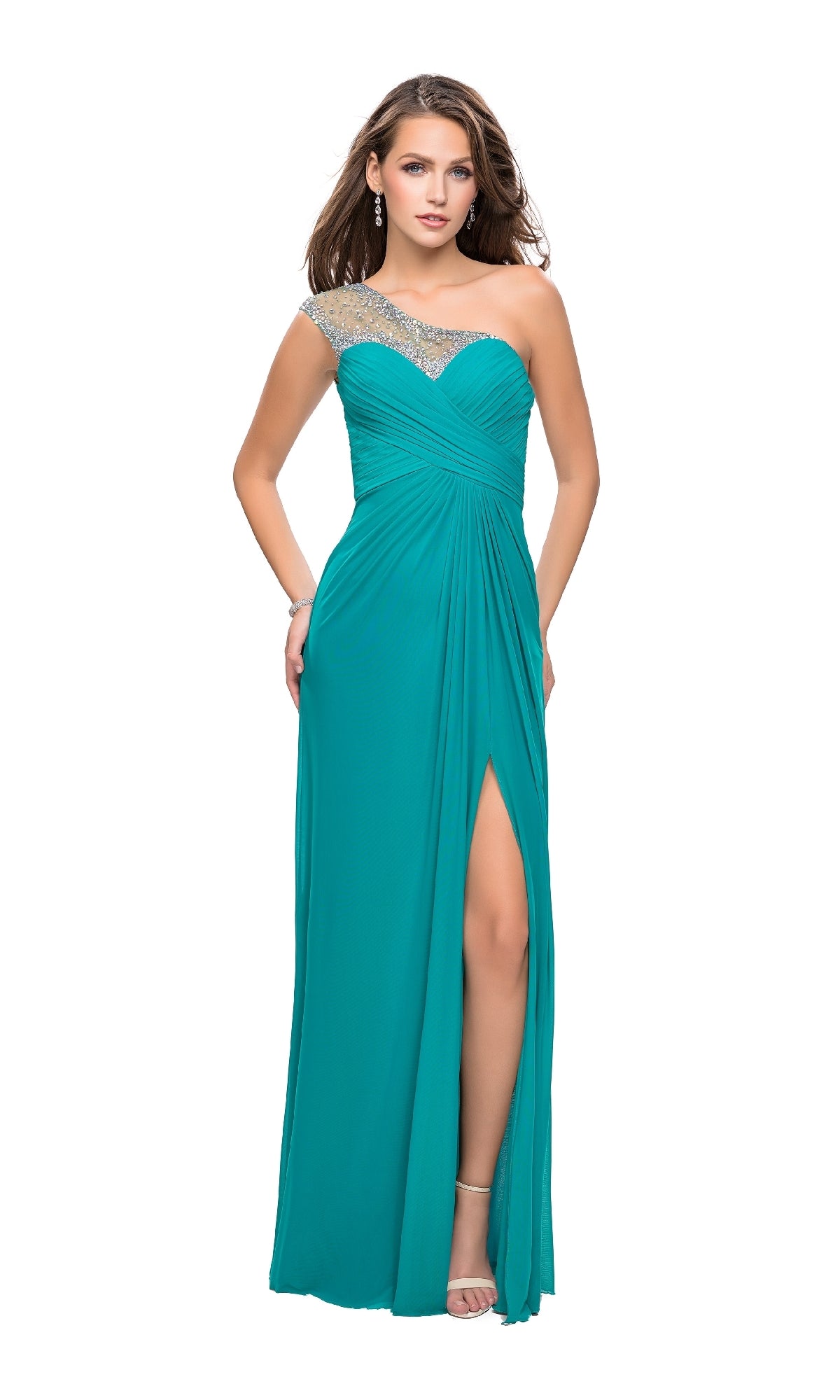A woman in the La Femme 20384 teal one-shoulder long prom dress with a thigh-high slit and rhinestone strap stands against a white background.