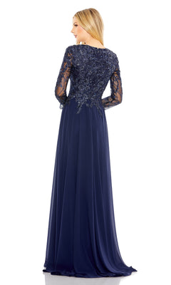 A woman is seen from the back wearing the Mac Duggal 20388 long sleeve special occasion dress, a floor-length navy chiffon gown with lace and sequin detail on the bodice and sleeves.